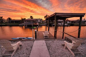 Serene twilight magic. Watch the sky melt into stunning hues as you relax by the dock—pure waterfront bliss!