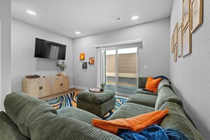 Step into the inviting open-concept living space, flooded with natural light. The contemporary decor and plush sectional is perfect for relaxing after a day of exploring. Need extra space for sleeping this couch is perfect and can easily sleep 2.