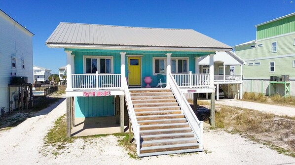 Situated between Little Lagoon and the beach, our boho chic Gulf Shores beach cottage offers the best of both worlds, everything you need for a fun and relaxing beach vacation.