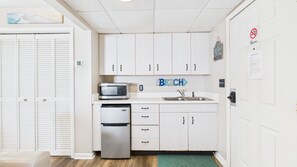 Kitchenette with basic cookware essentials
