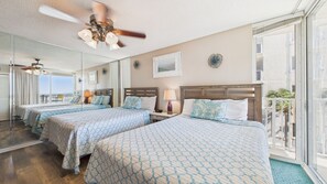 Two queen beds with balcony access and gulf views