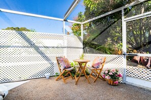 Patio sun room with a conversation table for 2
