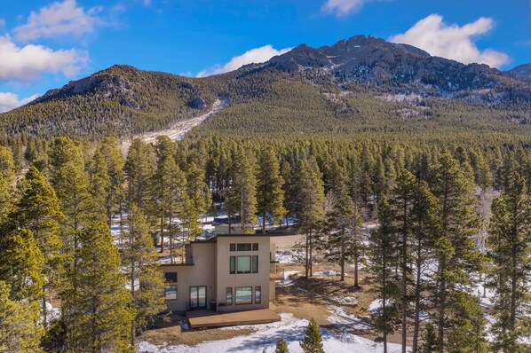 Home nestled below Twin Sisters mountains