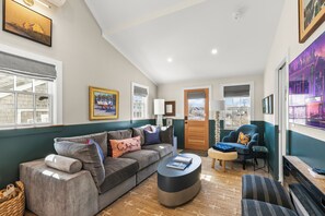 The spacious living room boasts high-end finishes and contemporary comforts