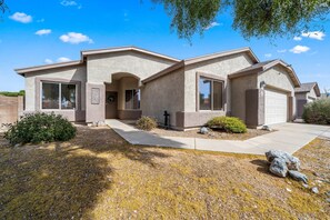 Front of the house. Guests can park in the driveway, street or garage.