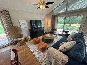 Spacious living room space with a cozy and comfortable decor.