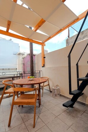 Faidra's Balcony - First floorOur shady balcony is equipped with an outdoor dining table for 4 people .A quite place with alley view that provides our visitors relaxation and tranquility.