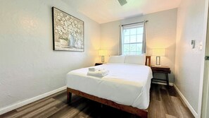 A welcoming space with warm lighting and cheerful artwork—ideal for restful nights and relaxing mornings.