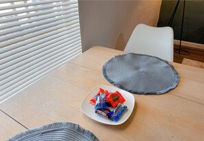 Minimalist and stylish dining area with a touch of modern elegance.