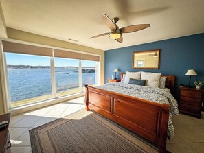 Wake up to breathtaking lake views from this spacious and elegantly designed bedroom, offering the ultimate relaxation.
