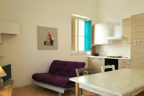 Living room-kitchen with sea view, sofa bed and HD TV