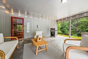 Take in the fresh mountain air while lounging on this inviting patio, complete with stylish seating and a beautiful natural backdrop.
