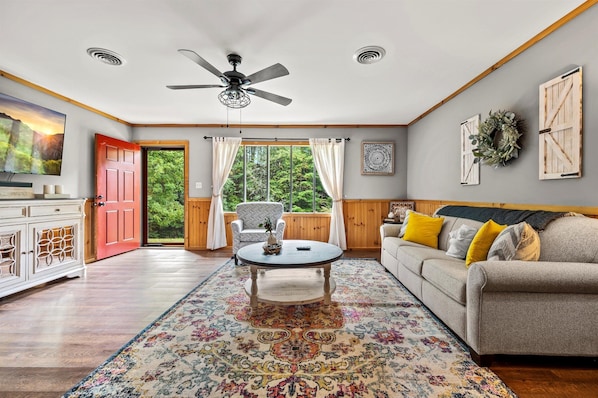 A living room designed for comfort and style, featuring elegant furnishings and a bright, inviting ambiance.