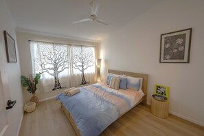 Second guest bedroom. Queen bed, fan, huge built in
