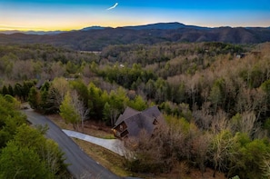 Birds-eye view our 3-level cabin at dusk.