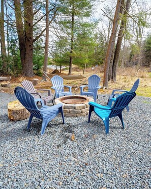 The backyard at Sinca Shores Lake House also offers a fire pit for you to enjoy.