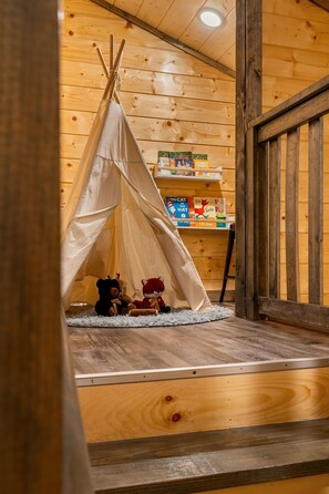 The kids will love spending time playing in the nook with the teepee, arcade and books.
