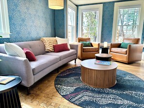 Enjoy the restored vintage details of the Living Room like the parquet floor.