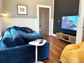 Melt into the Den's oversized couch for a cozy movie night.