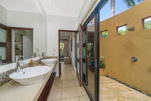 Master bathroom with outdoor shower and bathtub.