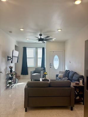 Spacious Living Room with 3 seat sofa, love seat, and chair. 