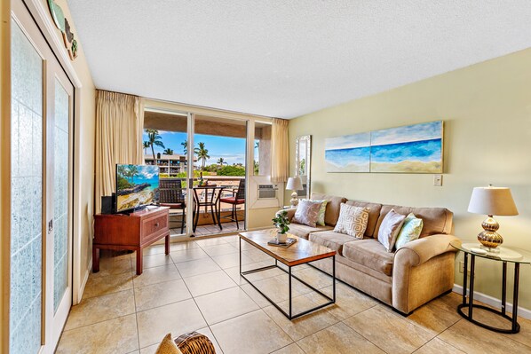 Relax in this cozy living space with comfortable seating and a warm, inviting atmosphere.