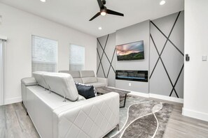 Natural light pours into the spacious open-concept living area, creating a welcoming and cozy space to relax and unwind.