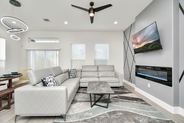 Enjoy your favorite shows on the TV in this cozy retreat – the perfect gathering place for comfort and entertainment
