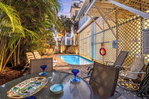 Shared Pool and Patio from outdoor pool area table.