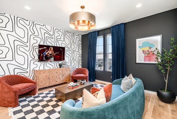 2nd Floor: Open-concept living area with a Smart TV and stylish furnishings.