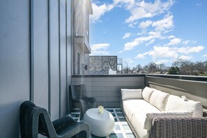 3rd Floor: 1st Private Patio with outdoor seating.