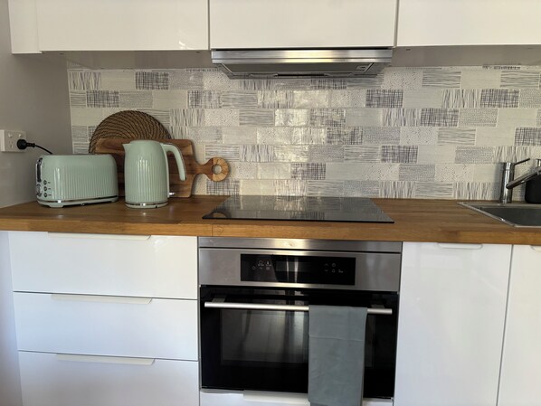 Kettle, toaster, microwave convection oven and induction cooktop
