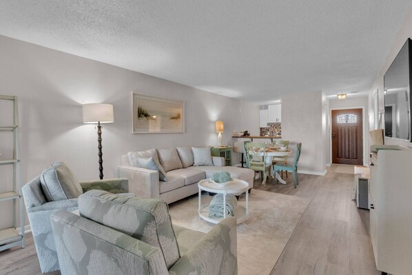 Full view of the cozy living room from the entrance—comfort meets convenience.
