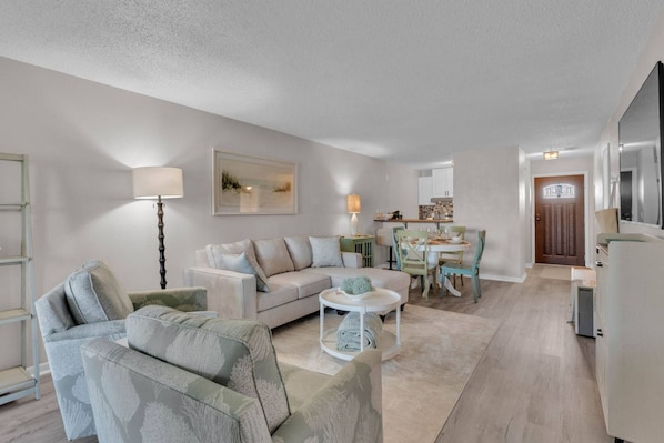 Full view of the cozy living room from the entrance—comfort meets convenience.