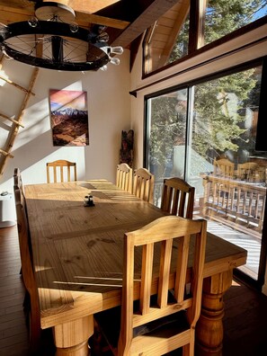 Dining table seats 8 and one of a kind wagon wheel chandelier.