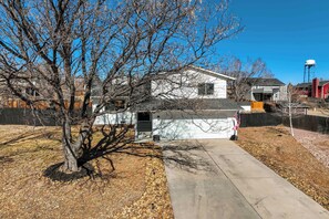 Charming home with a spacious driveway, mature tree, and a peaceful neighborhood setting!


