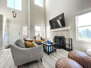 The spacious living room features a fireplace.