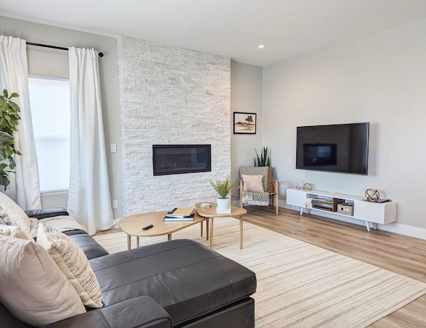 Our second living room features this beautiful fireplace and a Smart TV for your relaxation