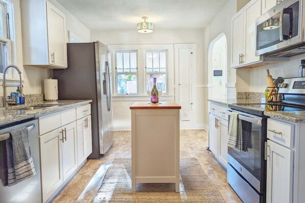 Cook your favorite meals in the stocked kitchen that comes with an electric stove, fridge, microwave. Essentials such as salt, pepper, cooking oil are provided.