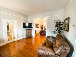 Relax in the spacious living room while streaming your favorite shows on Netflix, Hulu, Disney Plus