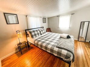 Cozy second bedroom featuring a queen bed