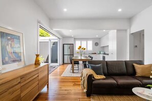 LOUNGE/DINING/KITCHEN: Sunny, spacious, open plan living room that opens to a large courtyard.