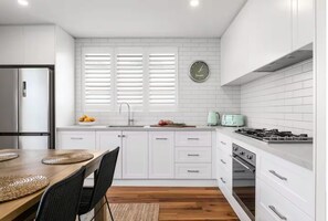 KITCHEN: The modern kitchen has all the needed appliances for cooking pleasure.