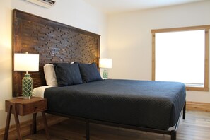 Bedroom Retreat: Sleek decor, inviting natural light, and a restful ambiance await you!  