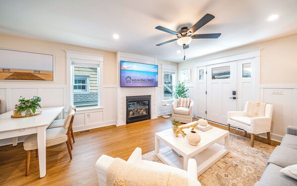 Spacious living room area with flat screen TV and fireplace