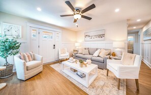 Lots of comfy seating with this cream themed living room!