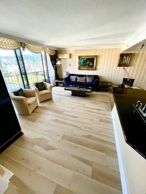 Spacious Living Room with Kitchen to the right