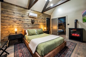 Retreat to the master suite with a full ensuite bathroom, fireplace, vaulted celling, and extra large windows.