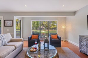 Sliding doors that lead to the expansive deck with tranquil views