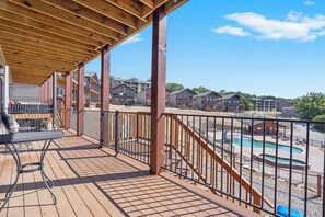 Lower Level Deck with a Direct Pool View and Stairs Directly Off the Deck for Easy Pool Access!